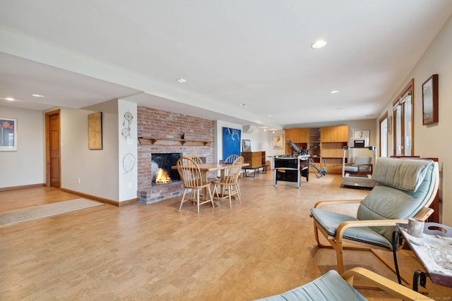 living room with a brick fireplace