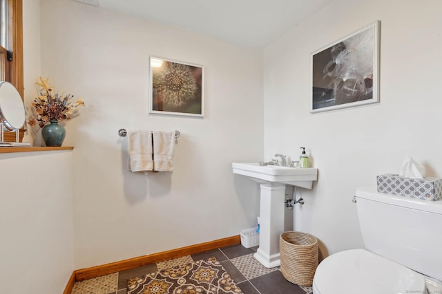 bathroom featuring tile patterned flooring and toilet