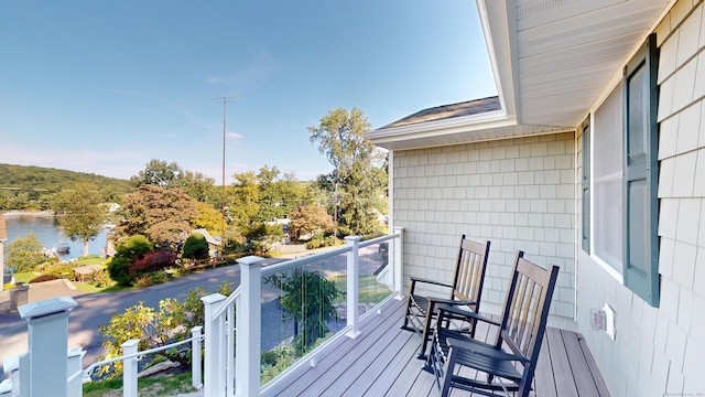 balcony featuring a water view