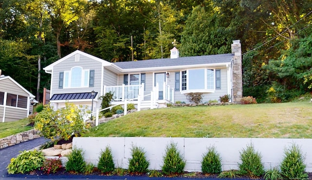 view of front of home with a front lawn