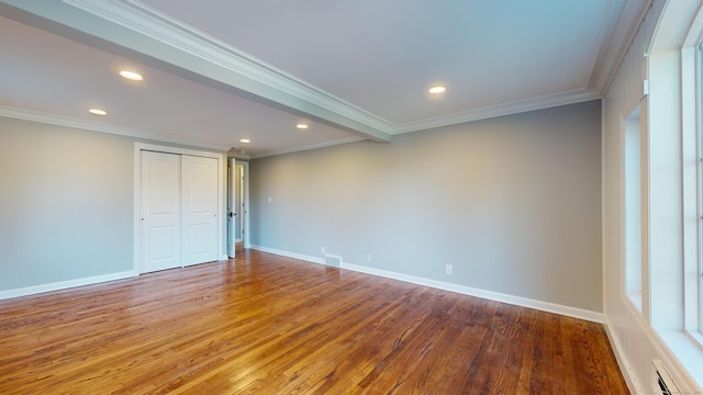 unfurnished room with recessed lighting, crown molding, and wood finished floors