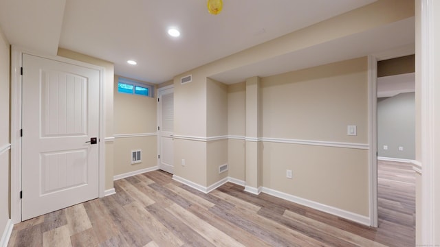 spare room featuring light wood-type flooring