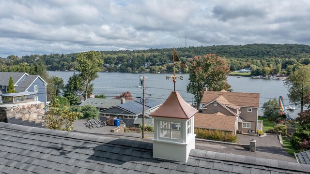 property view of water with a wooded view