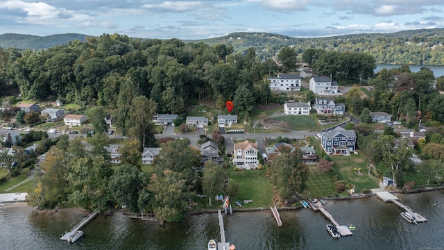 bird's eye view featuring a water and mountain view and a wooded view