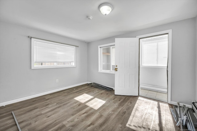 unfurnished room with dark hardwood / wood-style floors