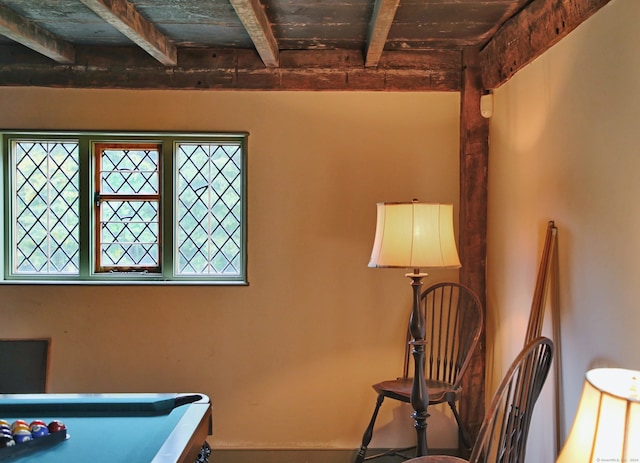 interior space with pool table, wood ceiling, and beamed ceiling