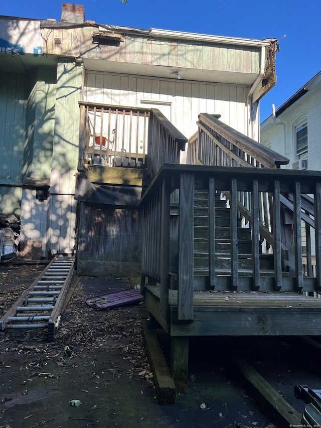 back of house with a wooden deck