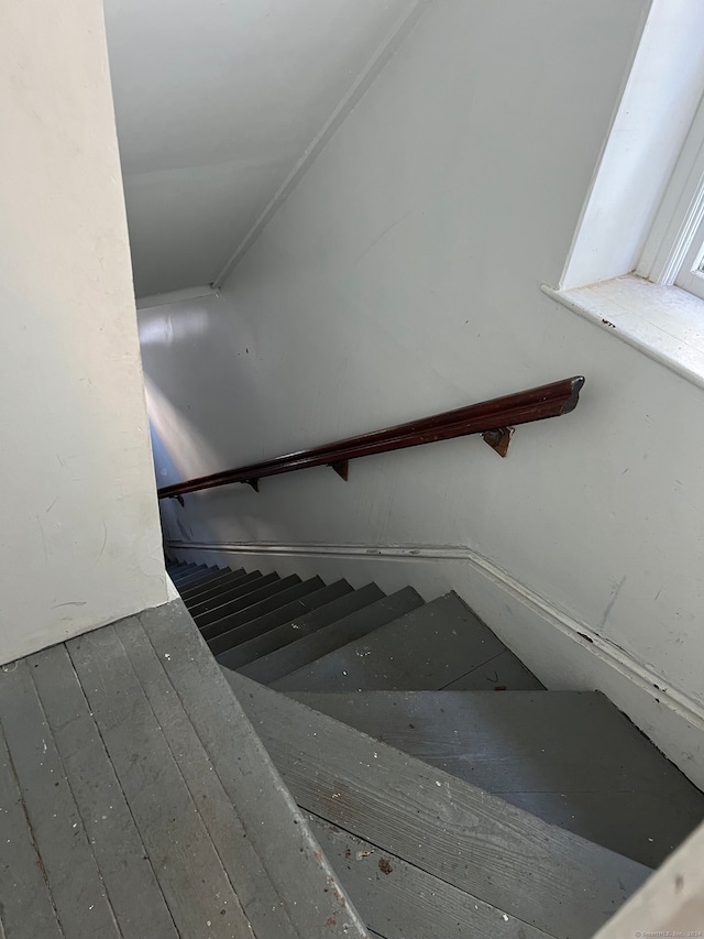 stairs featuring hardwood / wood-style flooring