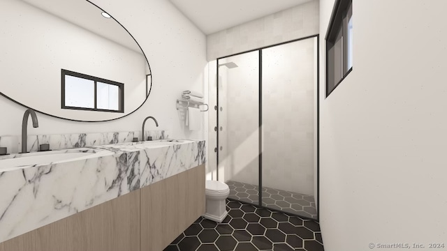 bathroom featuring tile patterned flooring, vanity, toilet, and a shower with shower door