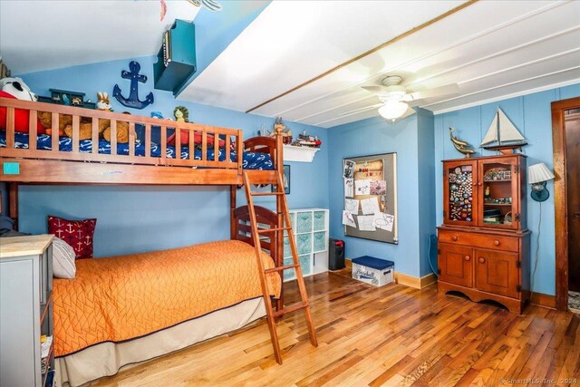 bedroom with ceiling fan and hardwood / wood-style floors