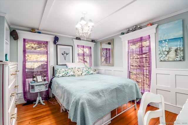 bedroom featuring light wood-type flooring and multiple windows