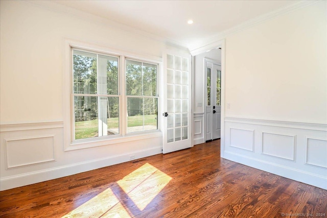 doorway to outside featuring ornamental molding, dark hardwood / wood-style flooring, and a healthy amount of sunlight