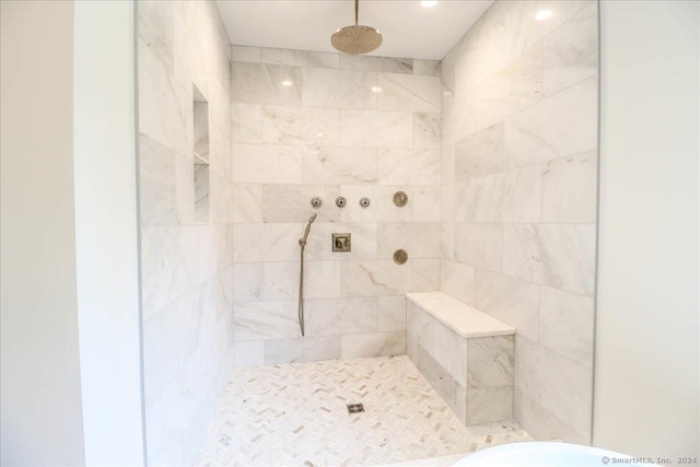 bathroom featuring tiled shower