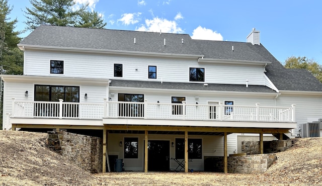 back of property featuring a deck