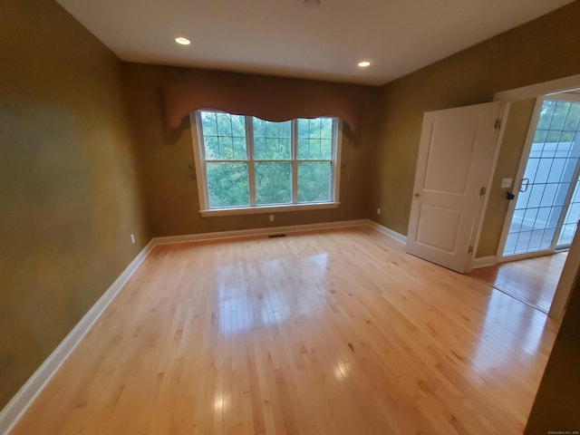 empty room with light wood-type flooring