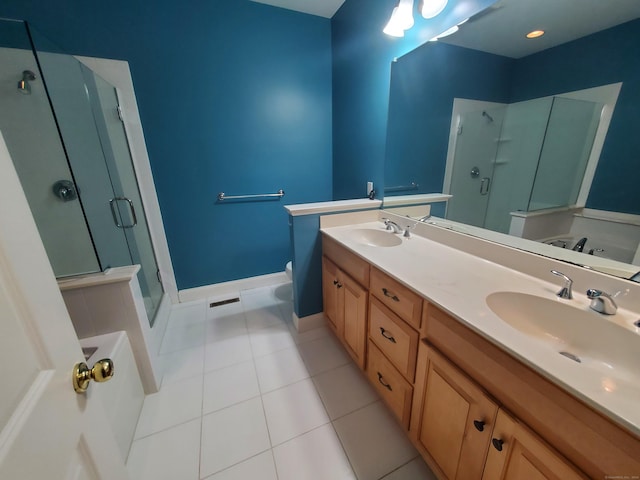 bathroom featuring tile patterned floors, vanity, and shower with separate bathtub