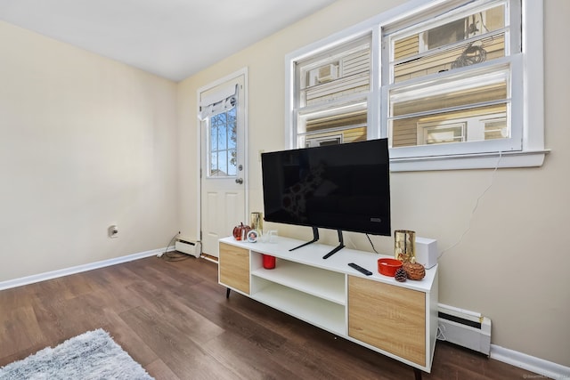 home office with baseboard heating and dark wood-type flooring