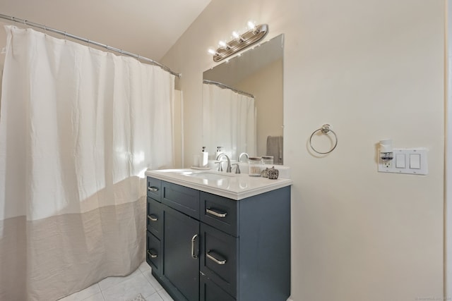 bathroom with tile patterned flooring and vanity