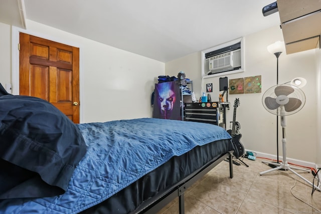 tiled bedroom featuring a wall unit AC