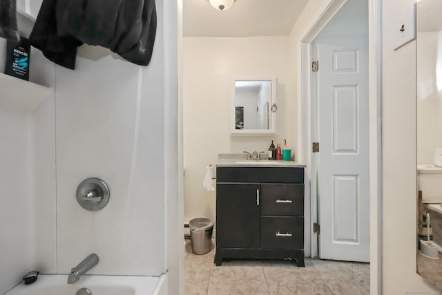 bathroom featuring tile patterned floors, vanity, and bathing tub / shower combination