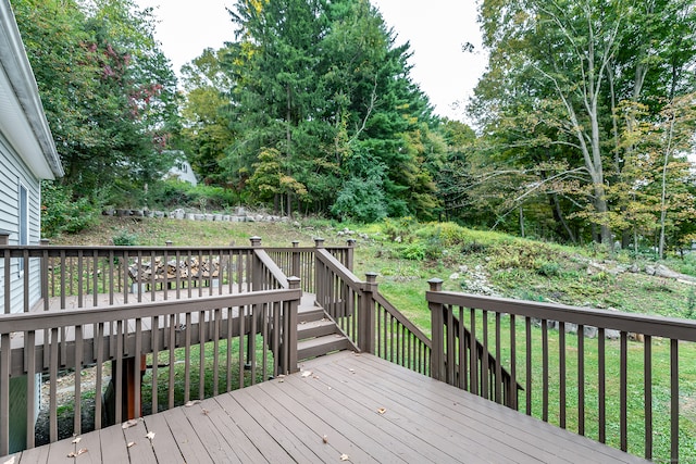 wooden terrace with a yard