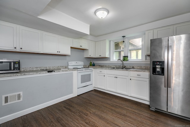 kitchen featuring appliances with stainless steel finishes, sink, dark hardwood / wood-style flooring, and white cabinets