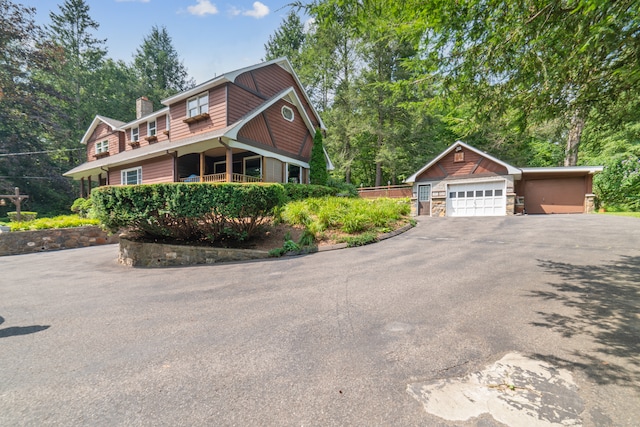 view of front of house featuring an outbuilding and a garage