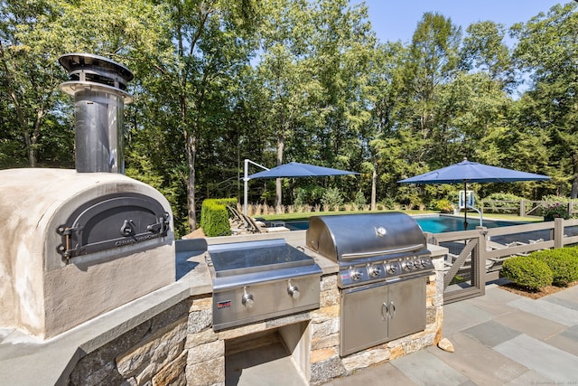 view of patio / terrace featuring an outdoor kitchen and grilling area