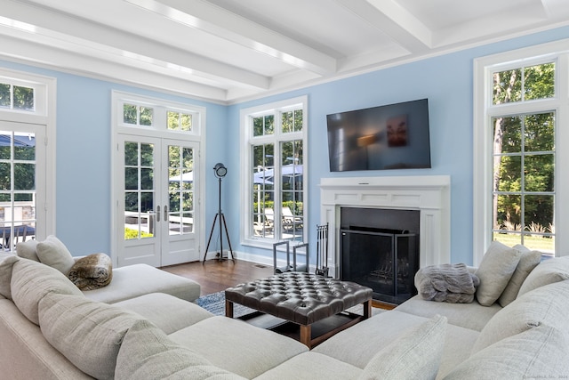 living room featuring plenty of natural light, beam ceiling, french doors, and hardwood / wood-style flooring