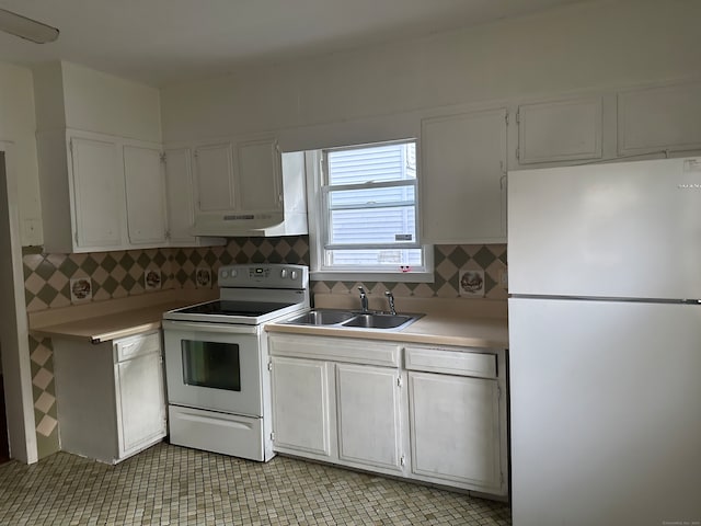 kitchen with white appliances, backsplash, white cabinetry, and sink