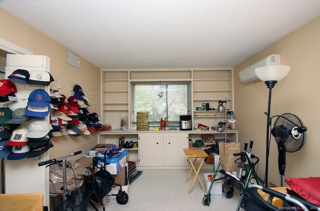 interior space featuring light colored carpet and an AC wall unit