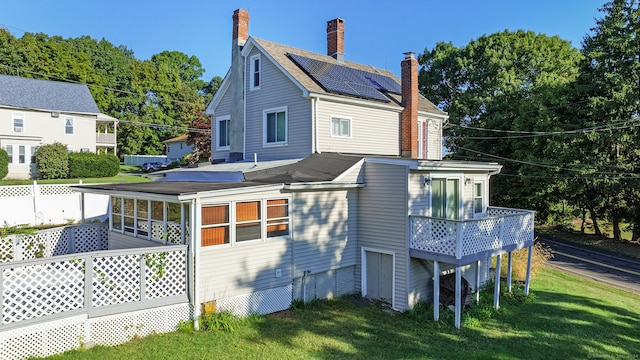 back of house with a yard