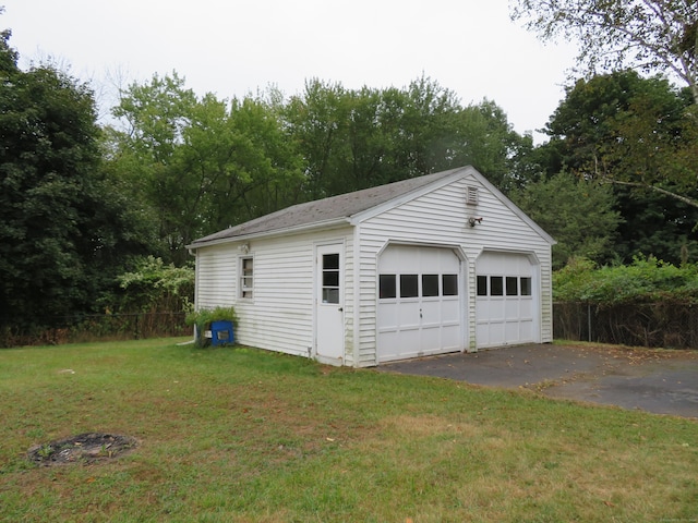 garage featuring a yard