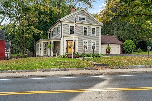 view of front of property with a front lawn and a garage