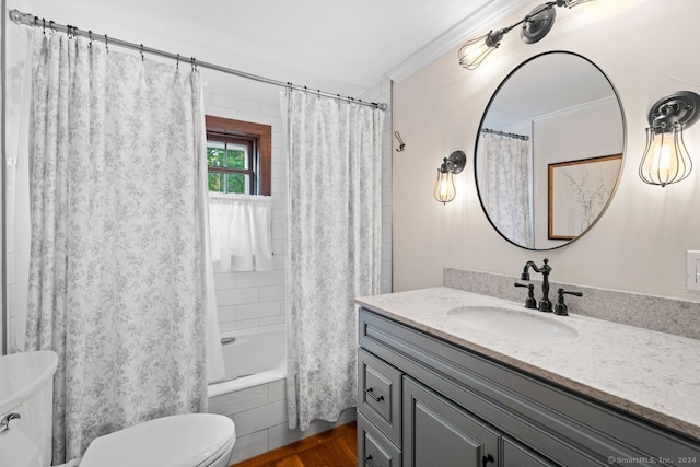 full bathroom featuring hardwood / wood-style floors, crown molding, shower / tub combo, vanity, and toilet