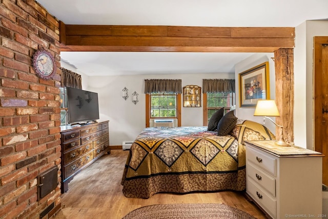 bedroom with beamed ceiling, a baseboard heating unit, and light hardwood / wood-style flooring