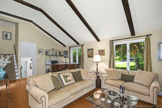 living room featuring lofted ceiling with beams and wood-type flooring