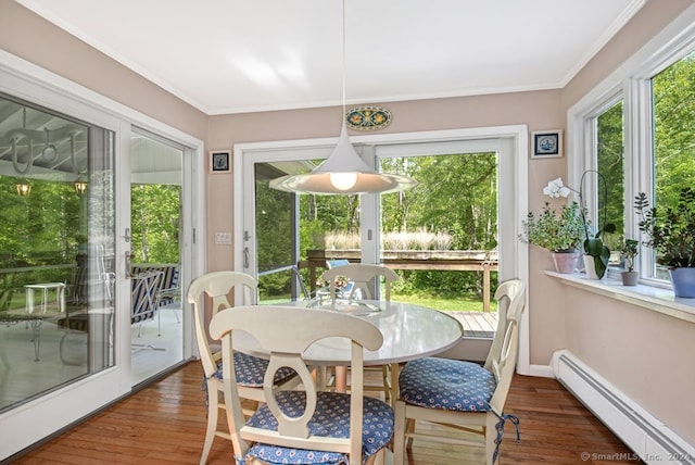 sunroom / solarium featuring baseboard heating