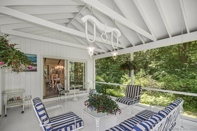 sunroom featuring vaulted ceiling