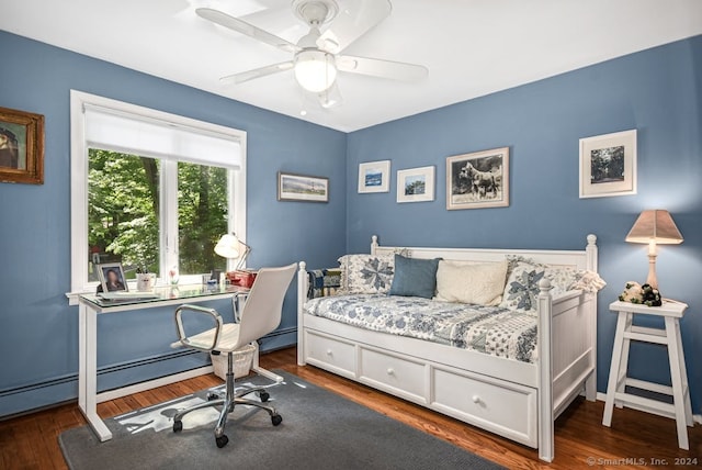 bedroom with dark hardwood / wood-style flooring and ceiling fan