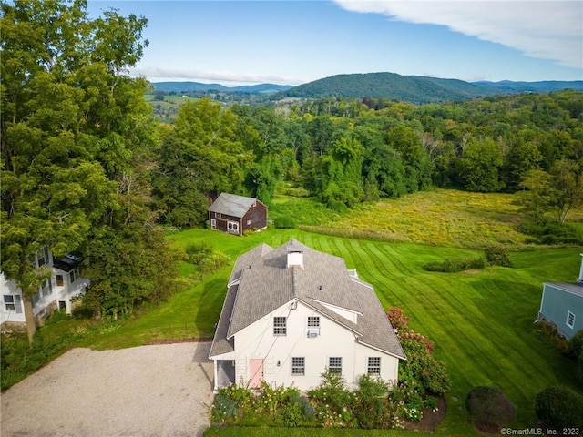 birds eye view of property with a mountain view