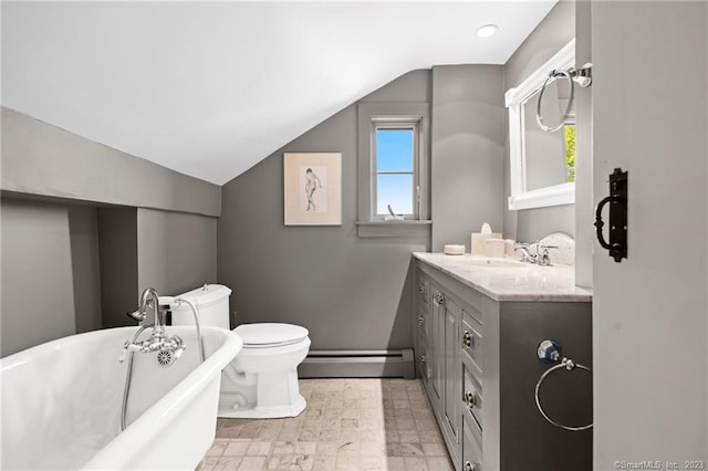 bathroom featuring a washtub, baseboard heating, vanity, vaulted ceiling, and toilet