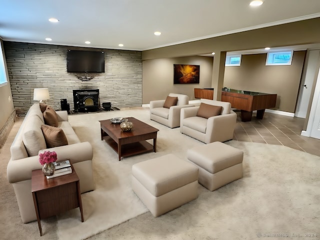 living room featuring crown molding, light tile patterned flooring, and a wood stove