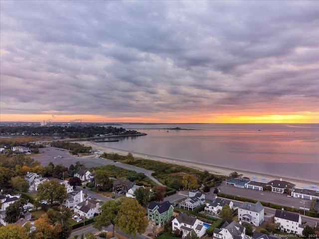 aerial view at dusk with a water view