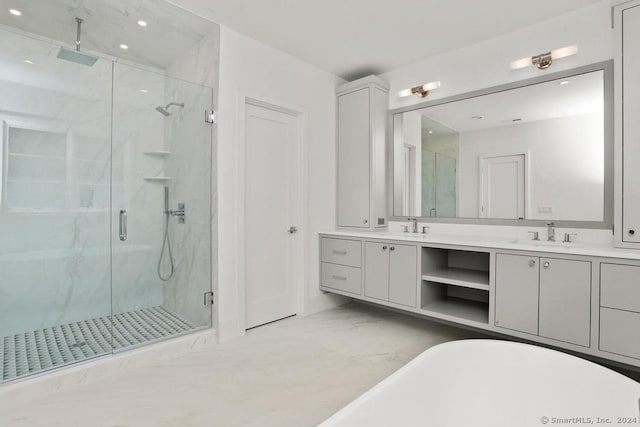 bathroom featuring vanity and plus walk in shower