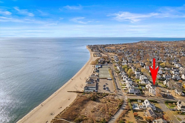 birds eye view of property featuring a water view and a view of the beach