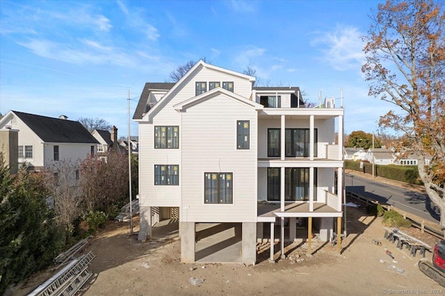 rear view of house featuring a balcony