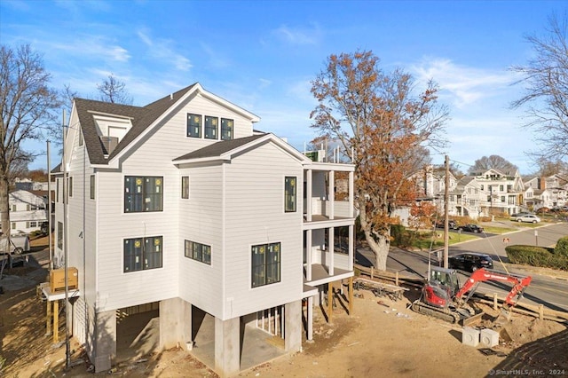 view of home's exterior featuring a balcony