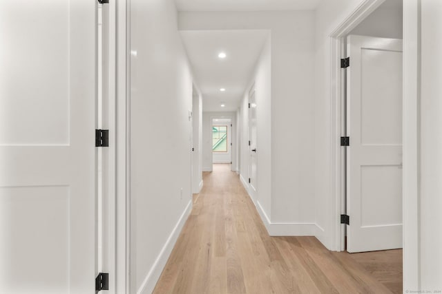 hall with light hardwood / wood-style floors