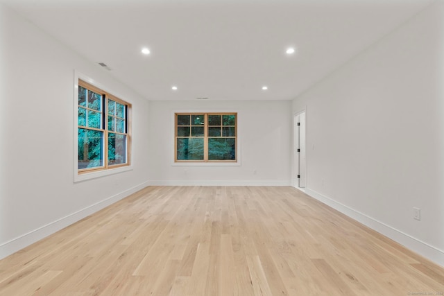 unfurnished room with light hardwood / wood-style flooring